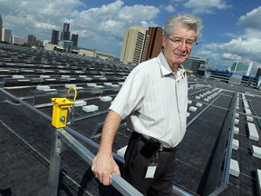 Sergio Grando, manager of energy initiatives with the city of Windsor, is seen on the roof of the Aquatic Centre in Windsor on Wednesday, September 3, 2014. The city is installing a network of solar panels on the roof.                (Tyler Brownbridge/The Windsor Star)