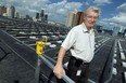 Sergio Grando, manager of energy initiatives with the city of Windsor, is seen on the roof of the Aquatic Centre in Windsor on Wednesday, September 3, 2014. The city is installing a network of solar panels on the roof.                (Tyler Brownbridge/The Windsor Star)