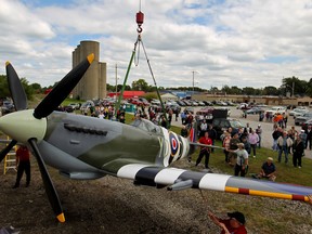 In this file photo, the Essex Memorial Spitfire, an exact replica of the Spitfire used by hometown World War II veteran, Jerry Billing, is hoisted by a crane onto its permanent resting place in Heritage Park, Sunday, Sept. 14, 2014.  (DAX MELMER/The Windsor Star)