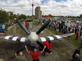 In this file photo, the Essex Memorial Spitfire, an exact replica of the Spitfire used by hometown World War II veteran, Jerry Billing, is hoisted by a crane onto its permanent resting place in Heritage Park, Sunday, Sept. 14, 2014.  (DAX MELMER/The Windsor Star)
