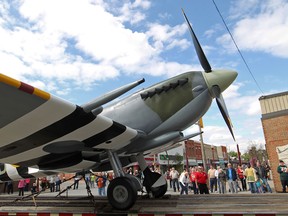 The Essex Memorial Spitfire, an exact replica of the Spitfire used by hometown World War II veteran, Jerry Billing, is transported down Talbot St. to its permanent resting place in Heritage Park, Sunday, Sept. 14, 2014.  (DAX MELMER/The Windsor Star)