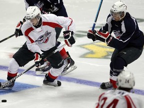 Windsor's Markus Soberg, left, and Cristiano DiGiacinto, competing in the annual Blue vs. White Game at WFCU Centre last month, are two of six Spitfires heading to NHL camps.  (NICK BRANCACCIO/The Windsor Star)