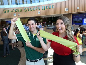 Brandon Seguin, Student Athletic Association president, and Sarah  Ryrie, Student Representative Council President and St. Clair Vice President of College Student Alliance during the grand opening of the St. Clair College SportsPlex in Windsor, Ontario on September 4, 2014. (JASON KRYK/The Windsor Star)