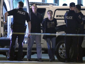 Windsor police arrest a woman after a 12 hour stand off at Tecumseh and Gladstone on Wednesday, Sept. 10, 2014, in Windsor, ON. (DAN JANISSE/The Windsor Star)
