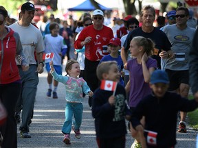 Participants take part in the Tecumseh Terry Fox Run after departing Green Acres Optimist Park in Tecumseh, Sunday, Sept. 14, 2014.  (DAX MELMER/The Windsor Star)