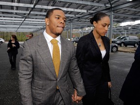 Baltimore Ravens football player Ray Rice holds hands with his wife, Janay Palmer, as they arrive at Atlantic County Criminal Courthouse in N.J. on May 1, 2014,  (Mel Evans/Associated Press)