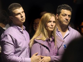 A vigil has held Friday, Sept. 12, 2014, for Emily Bernauer at the Verdi Club in Amherstburg, ON. The teenager was killed in a car accident last week. Her brother C.J. Bernauer (L), and parents Kim and Chris Bernauer are shown during the event. (DAN JANISSE/The Windsor Star)