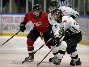LaSalle, Chris Pignanelli, right, controls the puck in front of teammate Nicolas Crescenzi and Leamington's Dallas Pereira, left, in exhibition action from Vollmer Centre. The Vipers open their regular season Wednesday night at home against the London Nationals. (NICK BRANCACCIO/The Windsor Star)