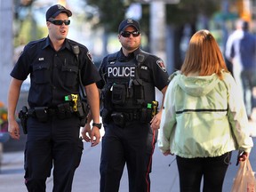 Two Windsor Police Service Constables walk the downtown beat on Monday, Sept. 22, 2014.   (DAN JANISSE/The Windsor Star) (For story by Craig Pearson)