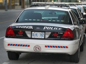 Windsor Police cruisers are shown near the downtown headquarters on Monday, Sept. 22, 2014. A study concluded that the department is overstaffed.  (DAN JANISSE/The Windsor Star)