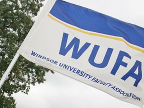 A Windsor University Faculty Association flag during the Labour Day parade on Sept. 1, 2014. (Dax Melmer / The Windsor Star)