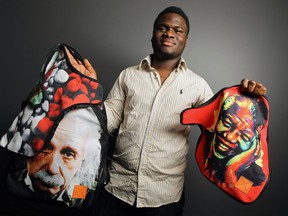 University of Windsor student George Oni, a budding entrepreneur and creator of The Kemis Supply Company, holds a pair of customized backpacks with an interchangeable back flap. (TYLER BROWNBRIDGE / The Windsor Star)