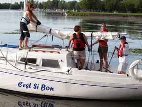 Star reporter Kelly Steele, second from right, joins C'est Si Bon's captain Christine Drouillard, right, and mates Gail Marcotte and Nancy Bencek, left, on the Detroit River. (NICK BRANCACCIO / The Windsor Star)