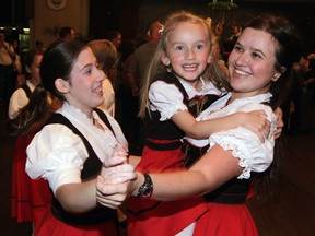 In this file photo, Teutonia Youth Group dancers Genna Norton, left, Meagan Israel and Karly Busch celebrate after the ceremonial beer keg tapping at Teutonia's Oktoberfest Friday, Oct. 3, 2014. Club president Christine Erdmann poured the first pitcher of beer at the annual festival. (NICK BRANCACCIO/The Windsor Star)