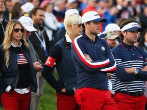 Keegan Bradley of the United States and partner Jillian Stacey (L) look dejected with Bubba Watson of the United States and wife Angie after Europe won the Ryder Cup during the Singles Matches of the 2014 Ryder Cup on the PGA Centenary course at the Gleneagles Hotel on September 28, 2014 in Auchterarder, Scotland.  (Photo by Ross Kinnaird/Getty Images)