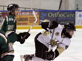 LaSalle Vipers Nikko Sablone, right, battles St. Thomas Stars Carter McCormick in Junior B hockey action from Vollmer Centre Wednesday October 15, 2014.  (NICK BRANCACCIO/The Windsor Star)