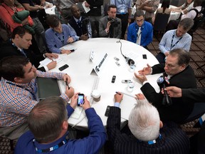 Michigan State basketball coach Tom Izzo, right, talks with reporters during a Big Ten college basketball media day in Rosemont, Ill. (AP Photo/Paul Beaty)