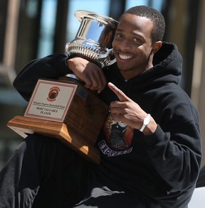 Windsor Express guard and finals MVP Stefan Bonneau makes his way down Ouellette during the championship parade. (DAX MELMER/The Windsor Star)