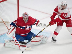 Montreal goalie Carey Price, left, makes a save against Detroit's Pavel Datsyuk Tuesday in Montreal. (THE CANADIAN PRESS/Graham Hughes)