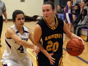 General Amherst's Kayla Daguerre,right, cuts around Assumption's Nicole Giacchini at Assumption Tuesday. (TYLER BROWNBRIDGE/The Windsor Star)