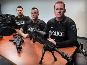 Windsor Police ESU members with some of the weaponry they use to fight crime at Windsor Police Tilston Armouries, Tuesday September 23, 2014. (NICK BRANCACCIO/The Windsor Star) S