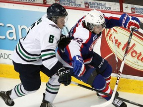 Plymouth's Mitch Jones, left, battles with Windsor's Sam Povorozniouk at the WFCU Centre. (NICK BRANCACCIO/The Windsor Star)