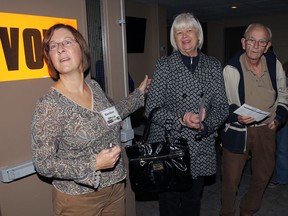 Polling station official Barbara Mero, left, controls flow of voters at Southwood Community Church Centre on Election Day Monday October 27, 2014. Voters Marcia Candido, Harry Bobbie and Zita Bobbie wait a few minutes to vote. (NICK BRANCACCIO/The Windsor Star)