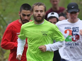 University of Windsor runner Phil Janikowski, centre, leads the cross-country team at Malden Park. (DAN JANISSE/The Windsor Star)