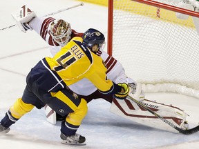 Ex-Spit Ryan Ellis, right, scored on Arizone goalie Devan Dubnyk during a shootout in Nashville. (AP Photo/Mark Humphrey)