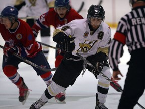 LaSalle's Korey Morgan, right, controls the puck in front of Strathroy's Lucas Latina at the Vollmer Centre Wednesday. (NICK BRANCACCIO/The Windsor Star)