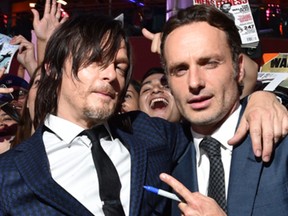 Norman Reedus, left, and Andrew Lincoln attend the season five premiere of The Walking Dead at AMC Universal Citywalk on Thursday, Oct. 2, 2014, in Universal City, Calif. (John Shearer/Invision for AMC/AP Images)