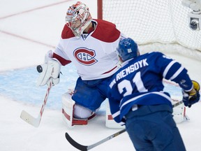Montreal goaltender Carey Price, left, makes a save on Toronto's James van Riemsdyk during second-period action in Toronto Wednesday. (THE CANADIAN PRESS/Darren Calabrese)