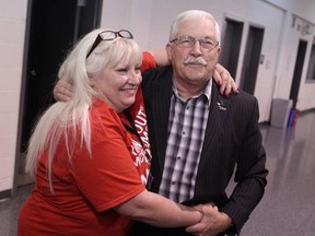 Essex mayor Ron McDermott is embraced by his daughter Pam McDermott at Essex Arena after being re-elected as mayor. (DAX MELMER/The Windsor Star)