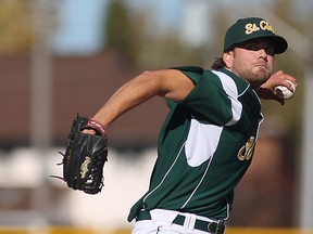 St. Clair's Rob Cooper, pitches during the seventh inning against the Brock Badgers during the OUA/OCAA Championship at Lacasse Park, Sunday, Oct. 26, 2014.  (DAX MELMER/The Windsor Star)