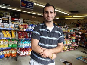 Rony Butris works at Wings Convenience in Windsor. (TYLER BROWNBRIDGE/The Windsor Star)