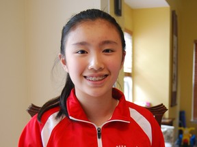 Jennifer Yu, 12, poses for a picture at her home in Ashburn, Va., on Oct. 9, 2014. Yu is the first American girl in 27 years to win a world chess championship, winning the girls 12-and-under tournament without losing a match at the recent World Youth Chess Championships in Durban, South Africa. (AP Photo/The Washington Post, Tom Jackman)