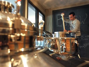 Joshua Goure works at the micro-brewery at the Brew bar in Windsor, ON. on Thursday, Oct 2, 2014. The Windsor Craft Beer Festival will begin Oct. 17, 2014. (DAN JANISSE/The Windsor Star)