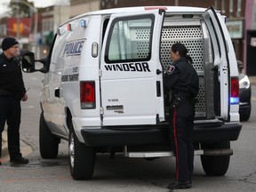 Windsor police transport a man after he was allegedly trying to break into a home at 1847 Moy, Saturday, Oct. 18, 2014.   (DAX MELMER/The Windsor Star)