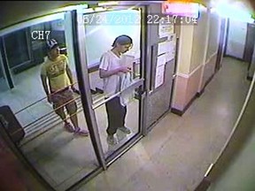 Luka Magnotta (right) is seen entering his Montreal apartment building the night of May 24, 2012 accompanied by Chinese student Jun Lin in a framegrab from a video released at the Magnotta trial. The surveillance video, shown to jurors at Magnotta's murder trial, is believed to show be the last time Lin was seen alive. THE CANADIAN PRESS