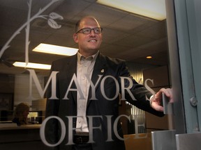Newly elected mayor Drew Dilkens looks out the door at his new office at Windsor City Hall on Oct 28, 2014. (JASON KRYK/The Windsor Star)