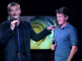 Retired astronaut Chris Hadfield and the Windsor Star's Dylan Kristy talk to the audience in the Windsor Star News Cafe on Oct. 17, 2014. (DAN JANISSE/The Windsor Star)