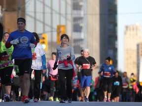 Runners participate in the 2014 Detroit Free Press Talmer Bank Marathon, Sunday, Oct. 19, 2014.  (DAX MELMER/The Windsor Star)