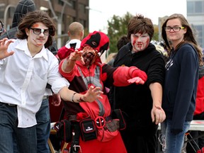 Zombies from left to right, Kyle Lemmon, 14, George DesRosiers, 35, Amer Velagie, 13 and Emily McLachlan, 14 gather after the walk Saturday, Oct. 18, 2014 at the 2014 Windsor Zombie Walk at Dieppe Park. Over 100 participants shambled from the riverfront, up and down Ouellette Avenue. (RICK DAWES/The Windsor Star)