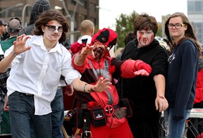 Zombies from left to right, Kyle Lemmon, 14, George DesRosiers, 35, Amer Velagie, 13 and Emily McLachlan, 14 gather after the walk Saturday, Oct. 18, 2014 at the 2014 Windsor Zombie Walk at Dieppe Park. Over 100 participants shambled from the riverfront, up and down Ouellette Avenue. (RICK DAWES/The Windsor Star)