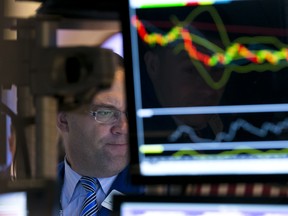 Specialist Anthony Matesic works at his post on the floor of the New York Stock Exchange, Friday, Oct. 10, 2014. U.S. stocks closed out a turbulent week with another loss, giving the market its worst week since May 2012.  (AP Photo/Richard Drew)