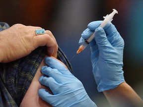 A man gets his flu shot. (Canadian Press files)