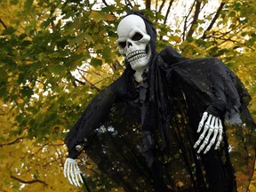 Halloween decorations are seen on the lawn of a home in south Windsor on Thursday, October 30, 2014. Trick or treaters will hit the streets on Halloween in search of candy. (TYLER BROWNBRIDGE/The Windsor Star)