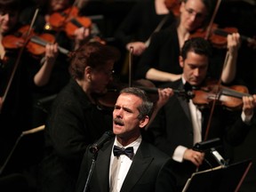 Canadian astronaut Chris Hadfield sings O Canada with WSO during Toldo Pops concert at Windsor's Capitol Theatre Friday October 16, 2014.  (NICK BRANCACCIO/The Windsor Star)