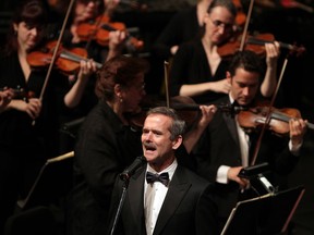 Canadian astronaut Chris Hadfield sings O Canada with WSO during Toldo Pops concert at Windsor's Capitol Theatre Friday October 16, 2014.  (NICK BRANCACCIO/The Windsor Star)