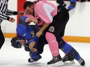 The Essex 73's DAn Mainella and the Amherstburg Admirals Steven Spada exchange blows at the Essex Centre Sports Complex in Essex on Tuesday, October 21, 2014.               (TYLER BROWNBRIDGE/The Windsor Star)